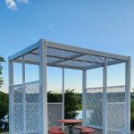 Maglin Head Office with Fava Tables and new Shade Structure with sky and pond in background