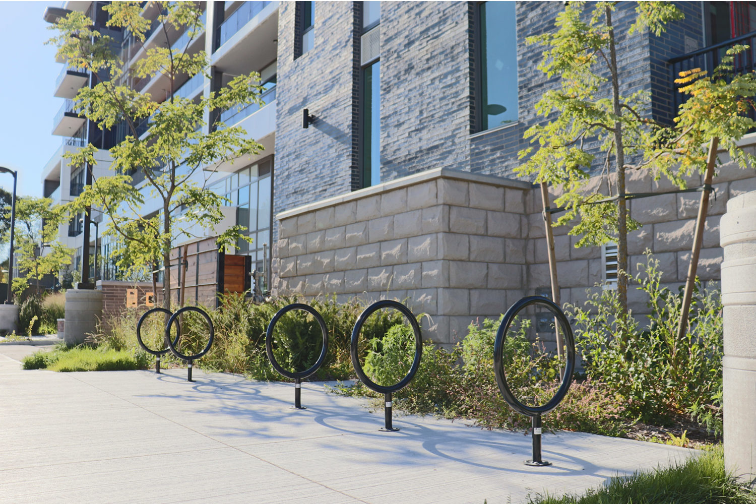 150 Series Bike Racks lined up in front of Metalworks apartment complex