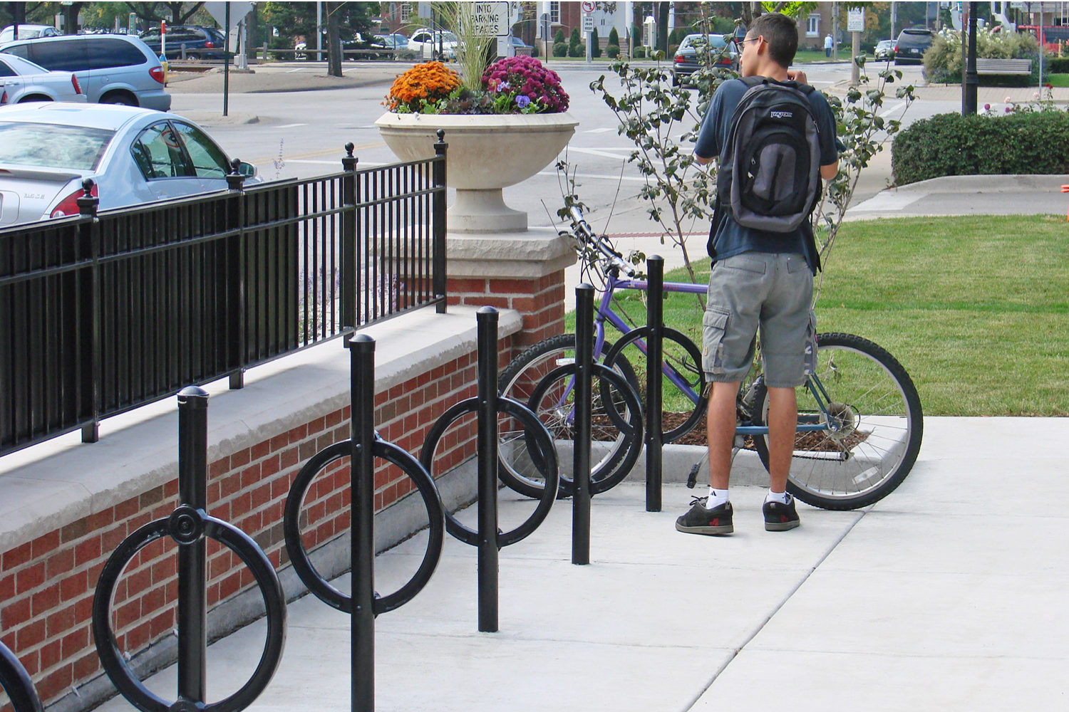 200 Series Bike Racks with man locking bike on Parkridge Main Street, IL