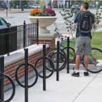 200 Series Bike Racks with man locking bike on Parkridge Main Street, IL