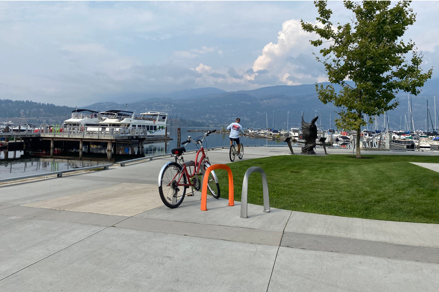 Bright orange and silver SC Bike Racks with an ocean view in Kelowna BC