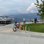 Bright orange and silver SC Bike Racks with an ocean view in Kelowna BC