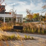 A Maglin Ogden Bench is placed on a paved pathway in AGORA Plaza in Gatineau.