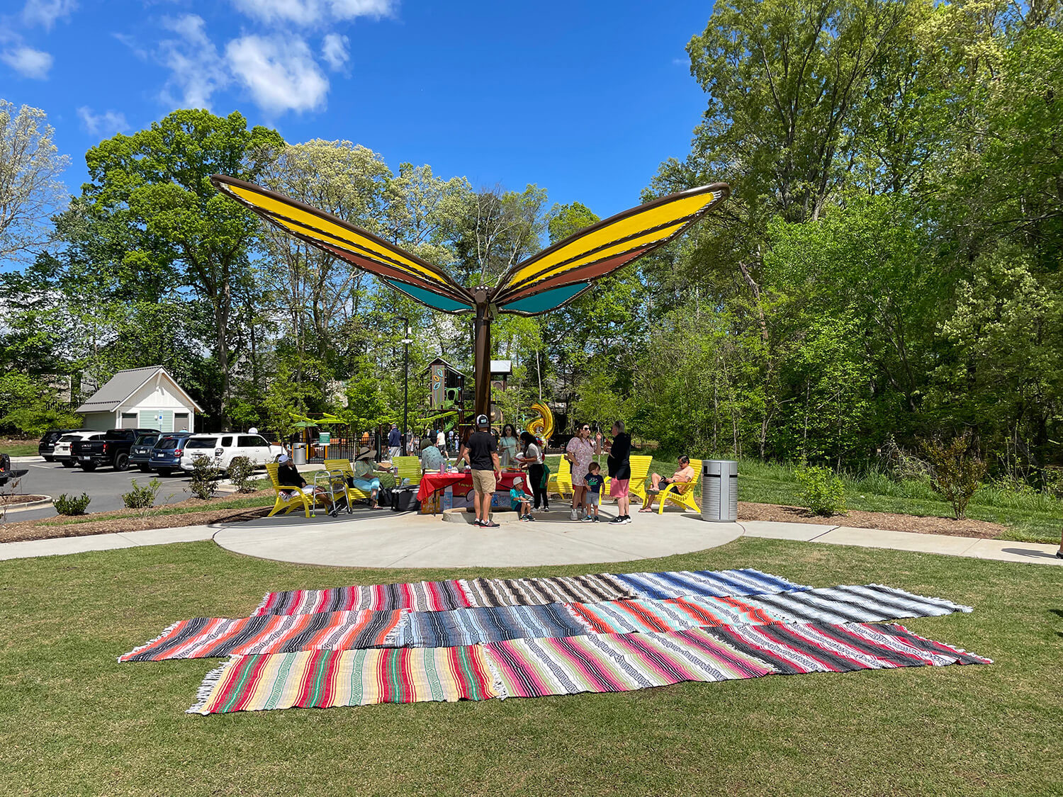 maglin-rosedale-nature-park_3 Butterfly shade structure providing shade for a family celebrating an event, whilst sitting on yellow 720 Maglin chairs