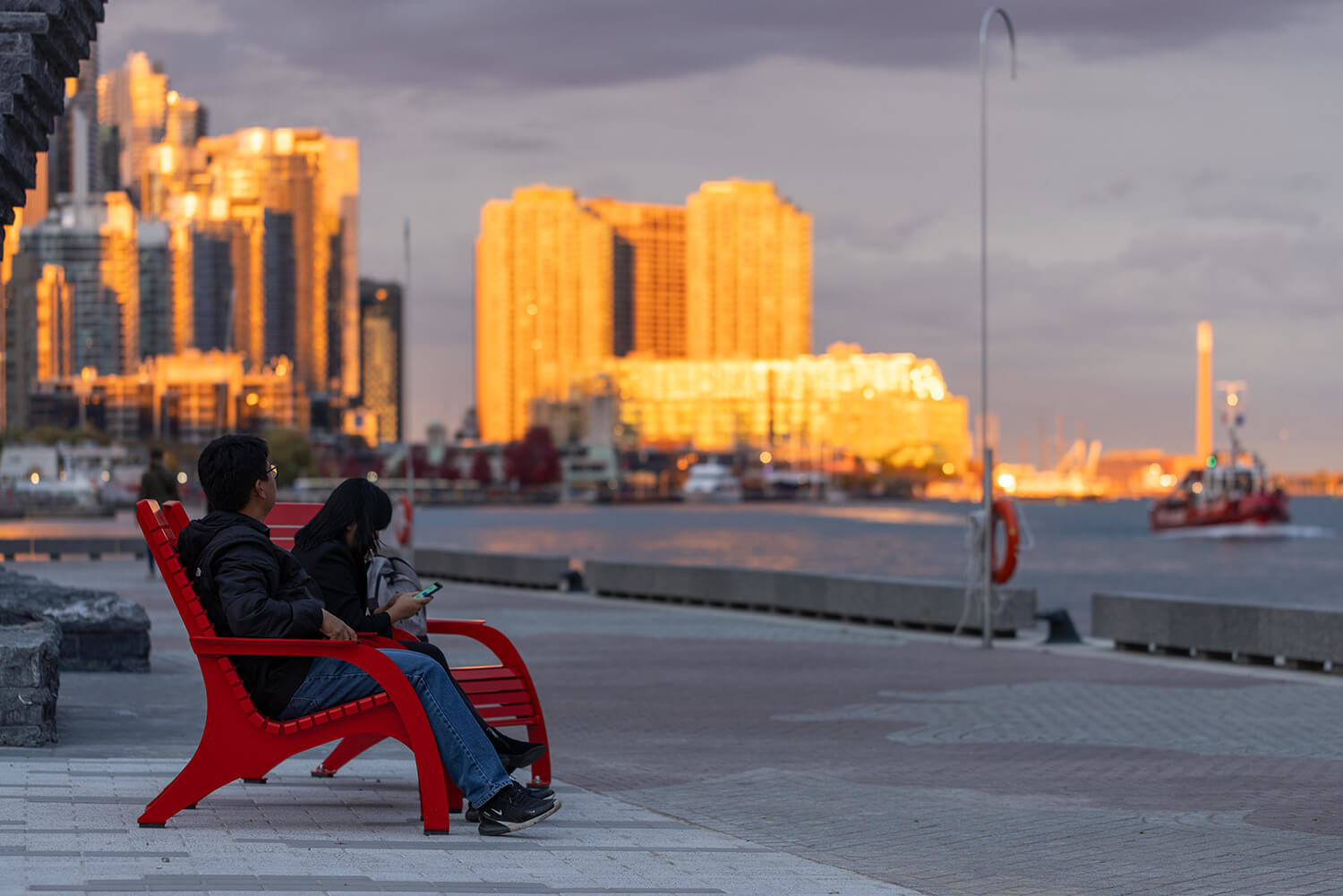 People enjoying the sunset at Bathurst Quay Commons while sitting in Maglin 720 Chairs
