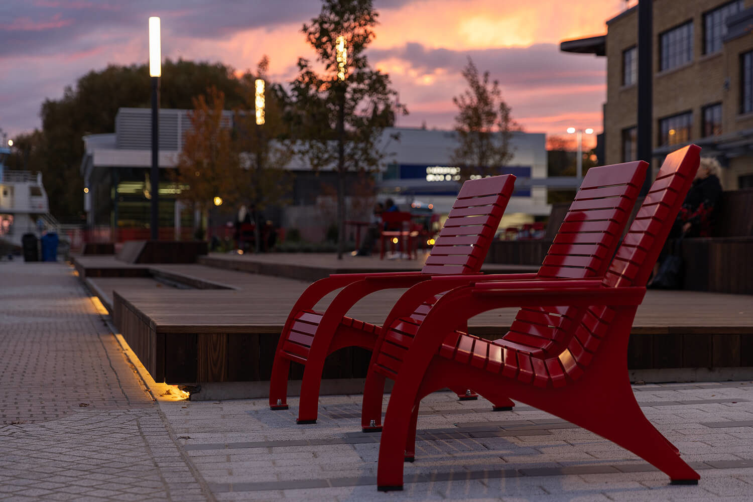 Maglin's 720 Chairs painted red against sunset at Bathurst Quay Commons