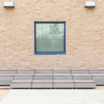 Maglin Pixel layout filled with short blocks stacked against a concrete wall with windows at CSUSM