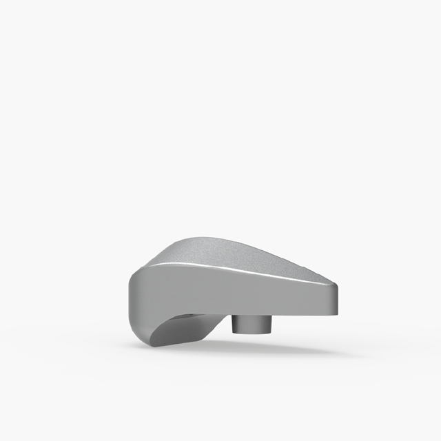 A metallic, wedge-shaped object with a smooth surface and a cylindrical protrusion on the bottom, set against a plain white background.