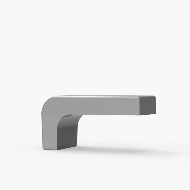 Un objet gris, en forme de L, aux bords lisses et au sommet plat, sur fond blanc.