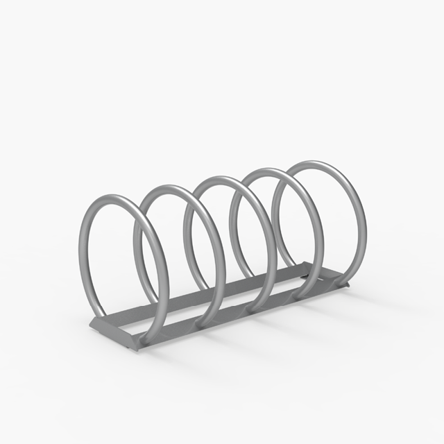 A metal spiral bike rack with five loops is placed on a flat surface against a plain white background.