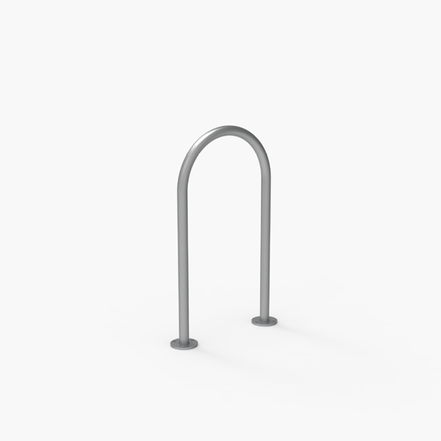 A simple, silver metal U-shaped bike rack is mounted on a plain white surface.