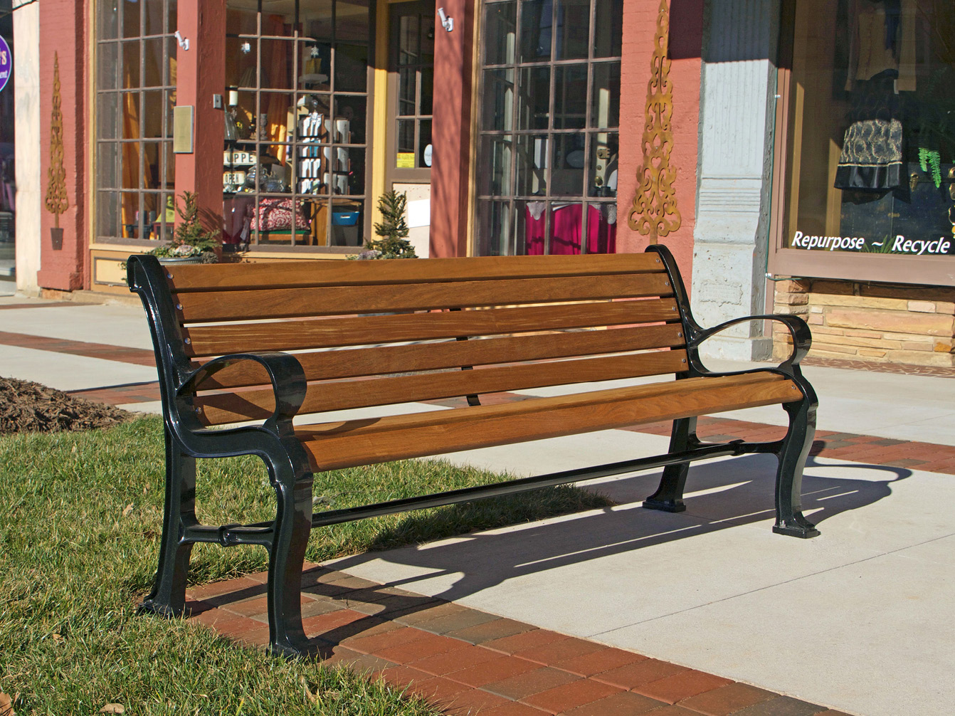 Maglin's 300 style wooden backed bench in front of storefront