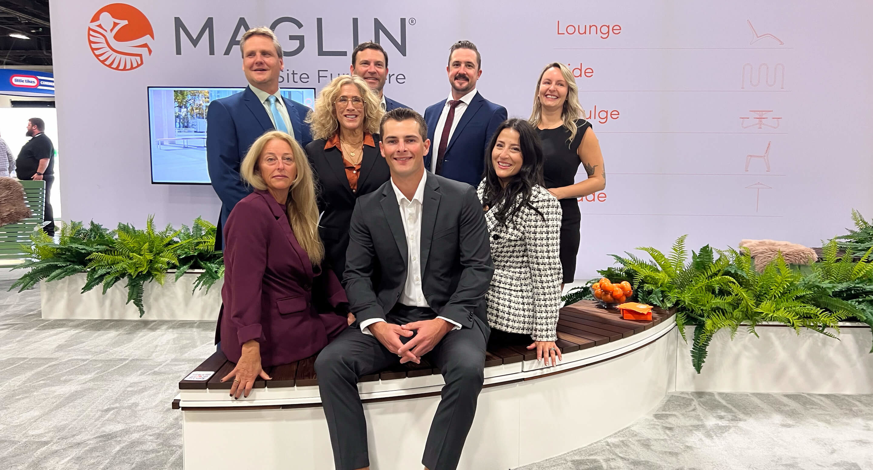 Maglin territory managers Jennifer, Brad, Amelie, Jeff, Barb, Andrew, Adam, and Jackie gather for a photo in the Maglin booth at ASLA 2025.