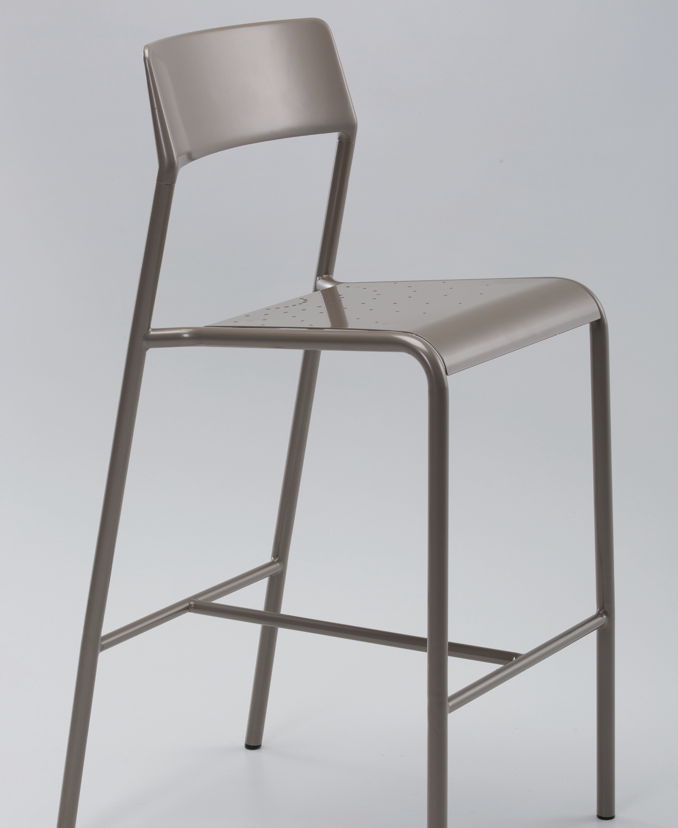 The Foro Bar Height Stool is a metal bar stool with a backrest and footrest, showcasing a minimalist modern design against a plain light background.