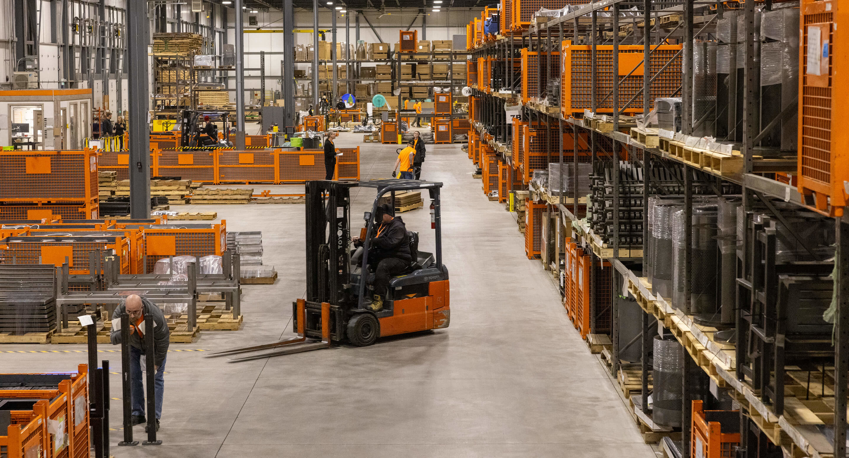 Maglin employees work in the production warehouse.