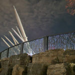 Custom FLEXX panels on rock wall against night sky