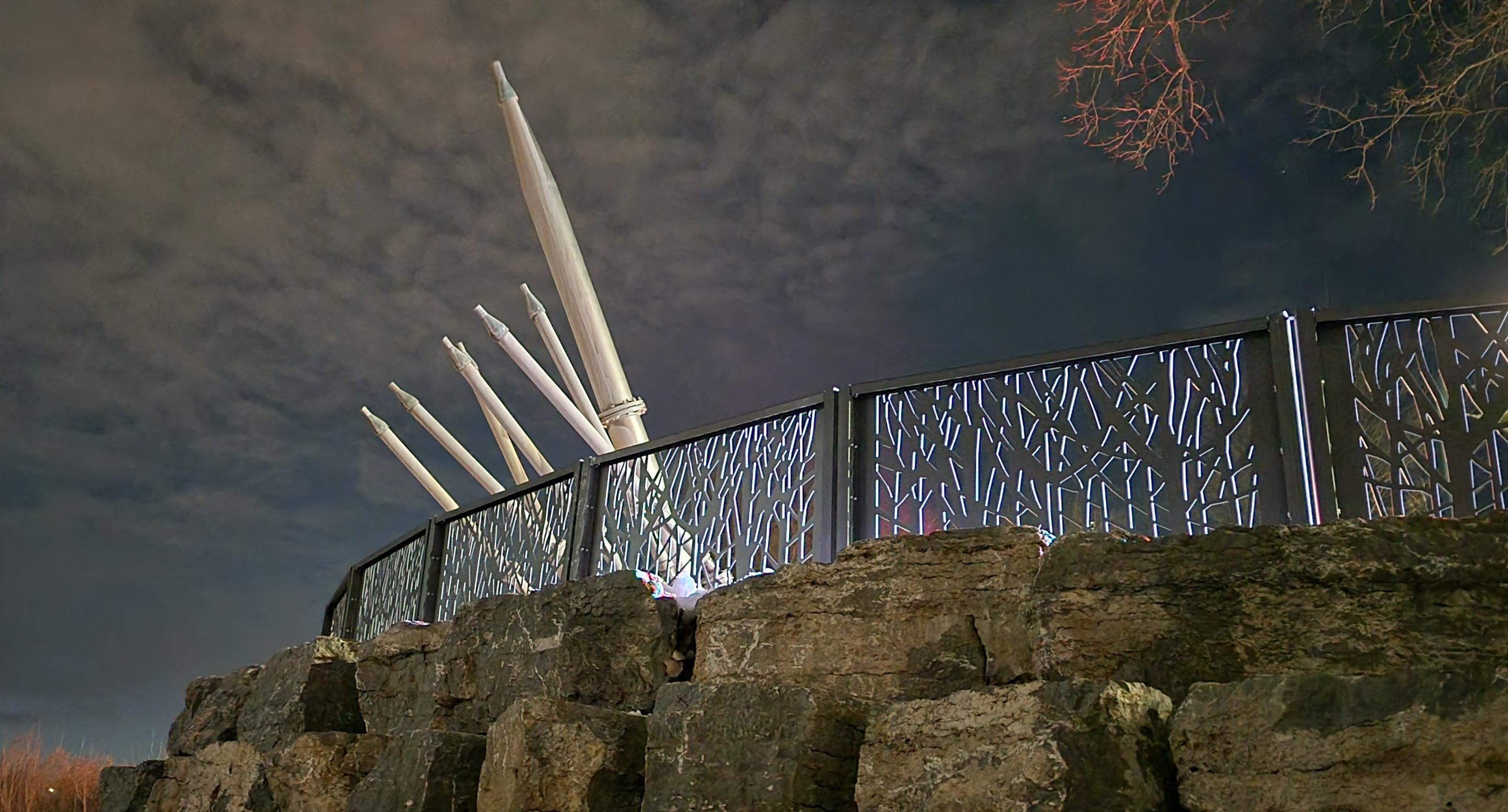 Custom FLEXX panels on rock wall against night sky