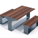 A modern outdoor picnic table set with two benches, featuring wooden slats and metal frames, placed on a white background.