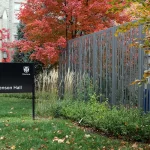 A black sign reading 